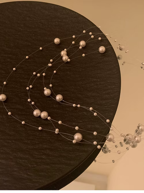 Elegant Multi-Strand Pearl Floating Necklace